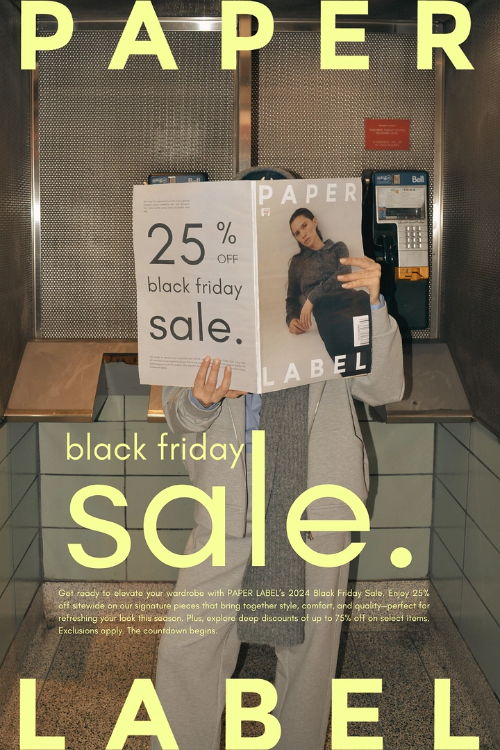 Black Friday creative ad: Person in a phone booth hiding their face behind a magazine