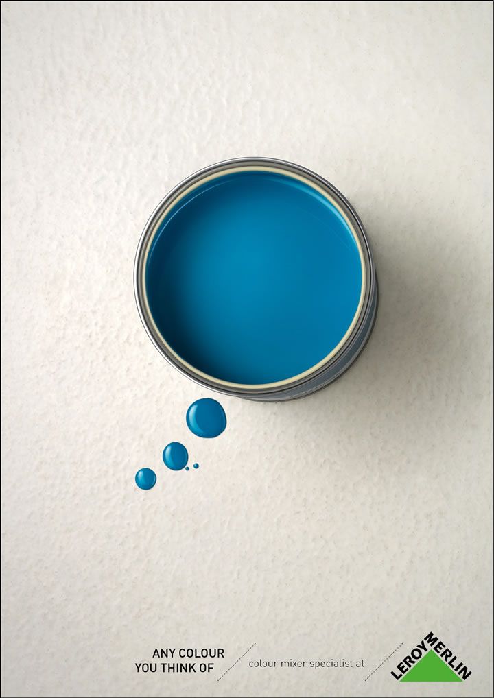 Top-down open blue paint can with droplets forming a thought bubble