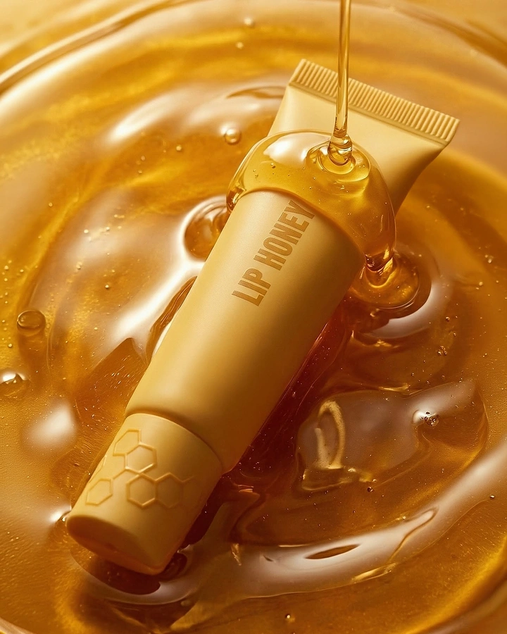 Honey Brands creative ad: Lip product immersed in honey