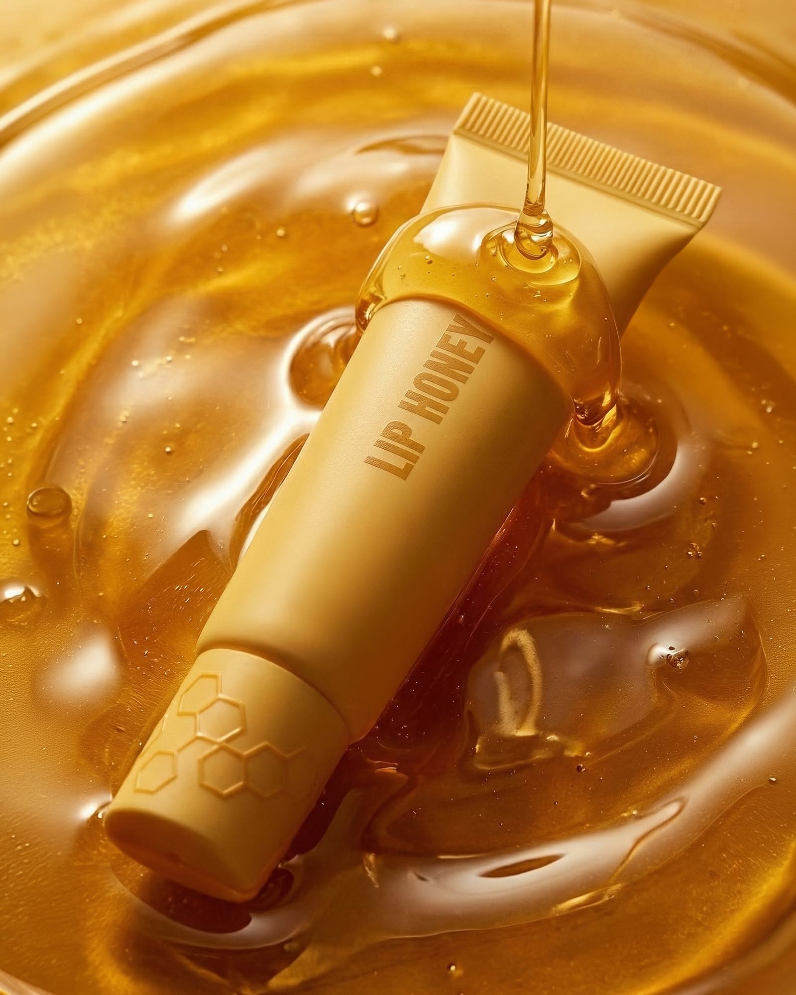 Instagram post: Lip product immersed in honey