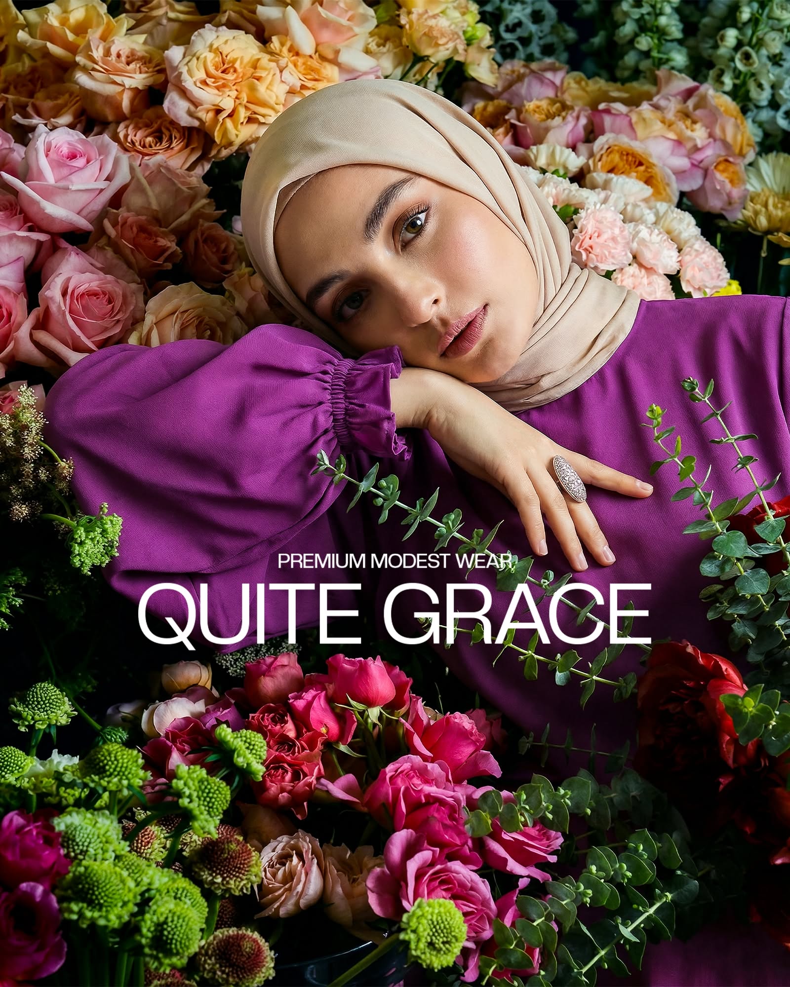 Instagram post: Hijabi model lying in a bed of roses in a purple dress