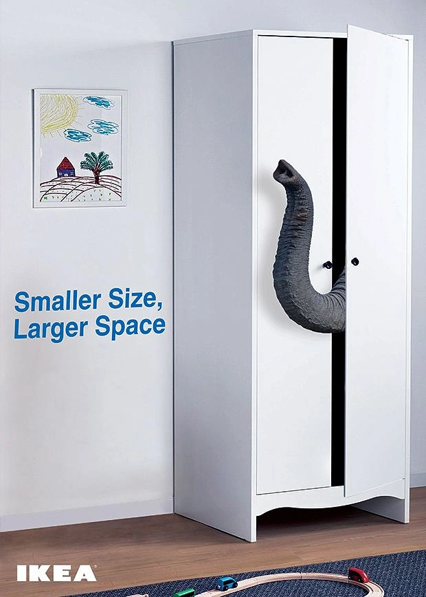 Creative ad: Elephant trunk poking out of a slim white wardrobe