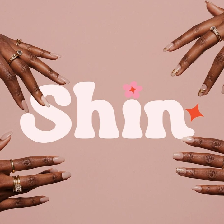 Nail Salons creative ad: Reaching hands frame bold Shin wordmark