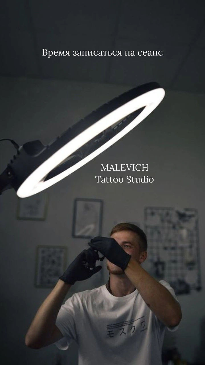 Tattoo Studios creative ad: Ring light as halo over tattoo artist