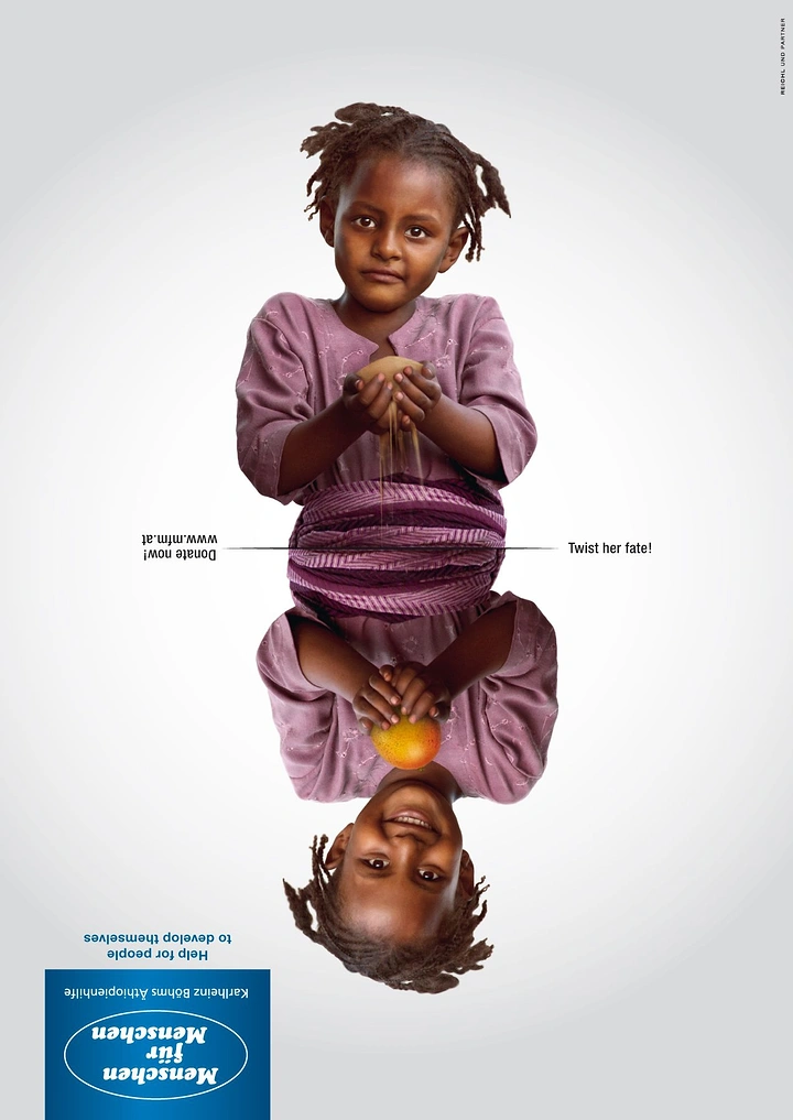 Creative ad: Mirrored child: sand slipping through her hands above, holding fruit and smiling below
