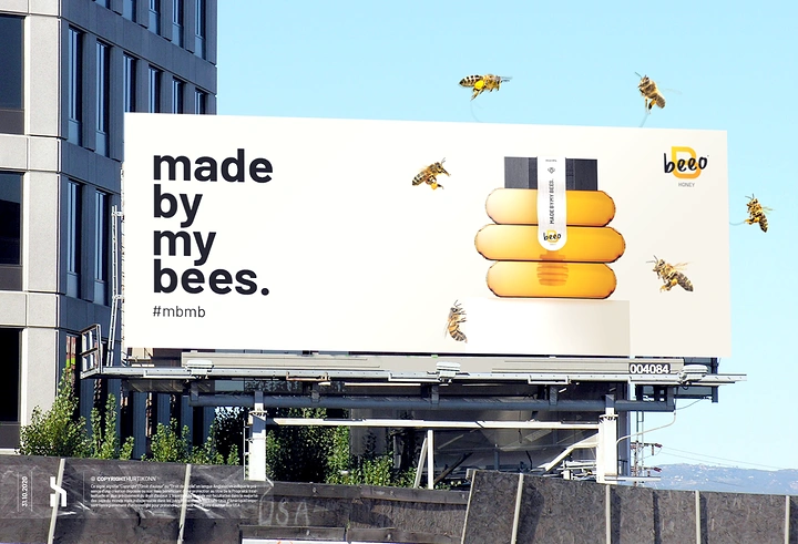 Honey Brands creative ad: Giant jar billboard, playful scale