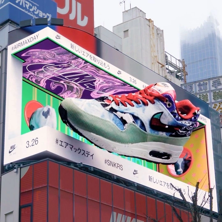 Streetwear creative ad: Giant patchwork sneaker bursting out of a curved 3D billboard