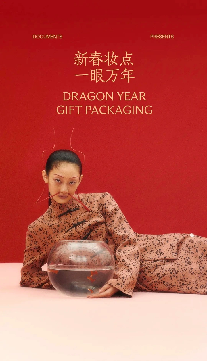 Lunar New Year creative ad: Reclining model in qipao beside a goldfish bowl
