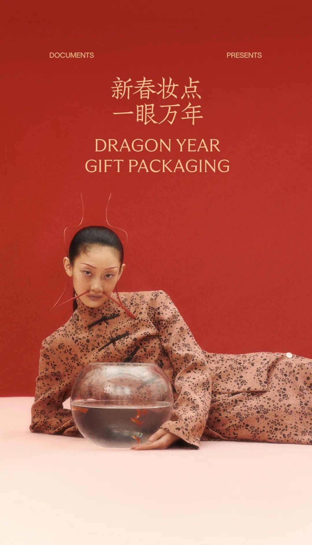Lunar New Year Story: Reclining model in qipao beside a goldfish bowl