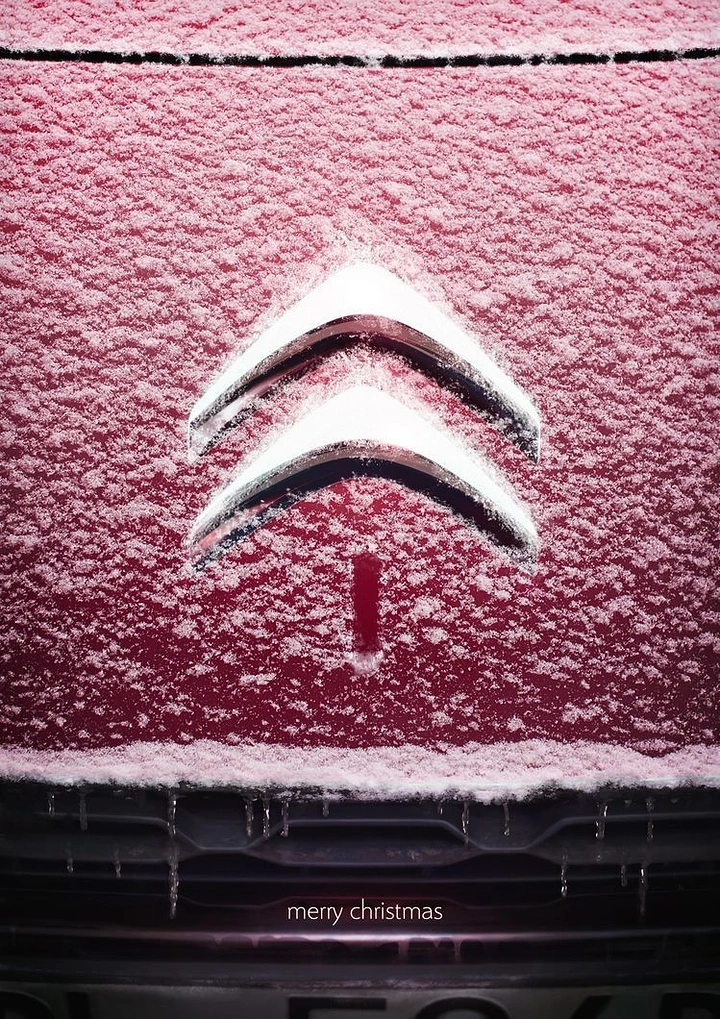 Christmas creative ad: Snow-dusted car emblem forming a Christmas tree shape