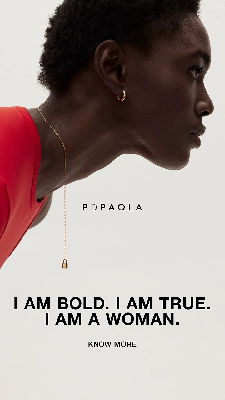 Women's Day creative ad: Profile of a woman leaning forward with a dangling gold padlock necklace