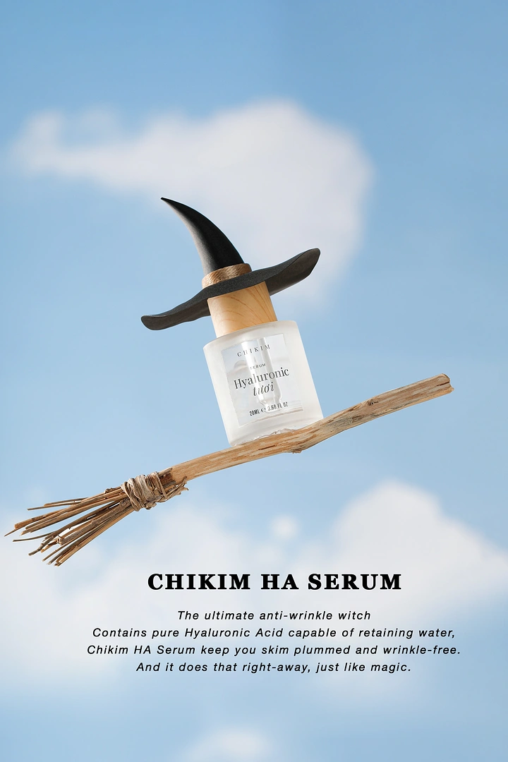 Halloween creative ad: Serum bottle in a witch hat riding a twig broomstick through the sky