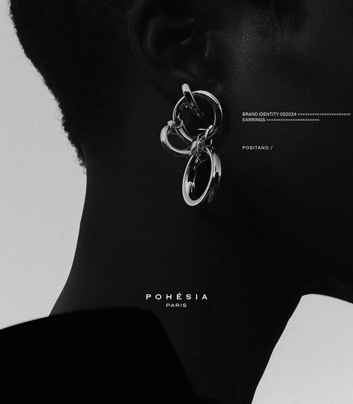 Jewellery creative ad: Chunky silver linked-hoop earring on a silhouetted profile