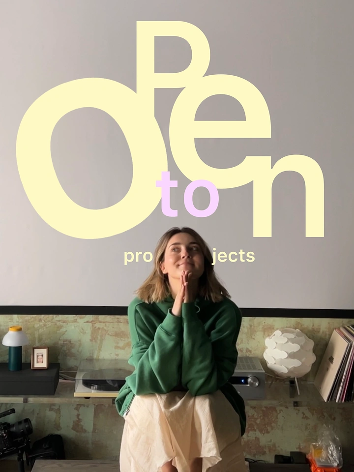 Photography creative ad: Oversized 'Open' letters framing subject's head