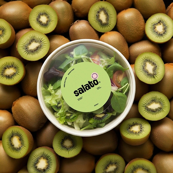 Salad Bars & Healthy Restaurants creative ad: Salad package staged among kiwi fruit