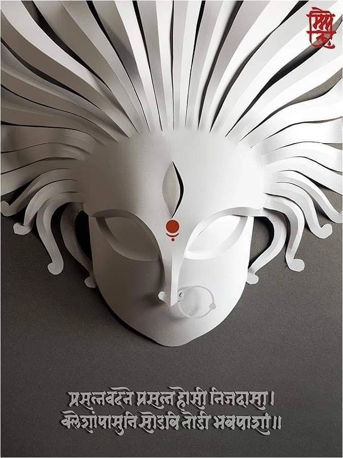 Navratri creative ad: White paper-sculpture face of Goddess Durga