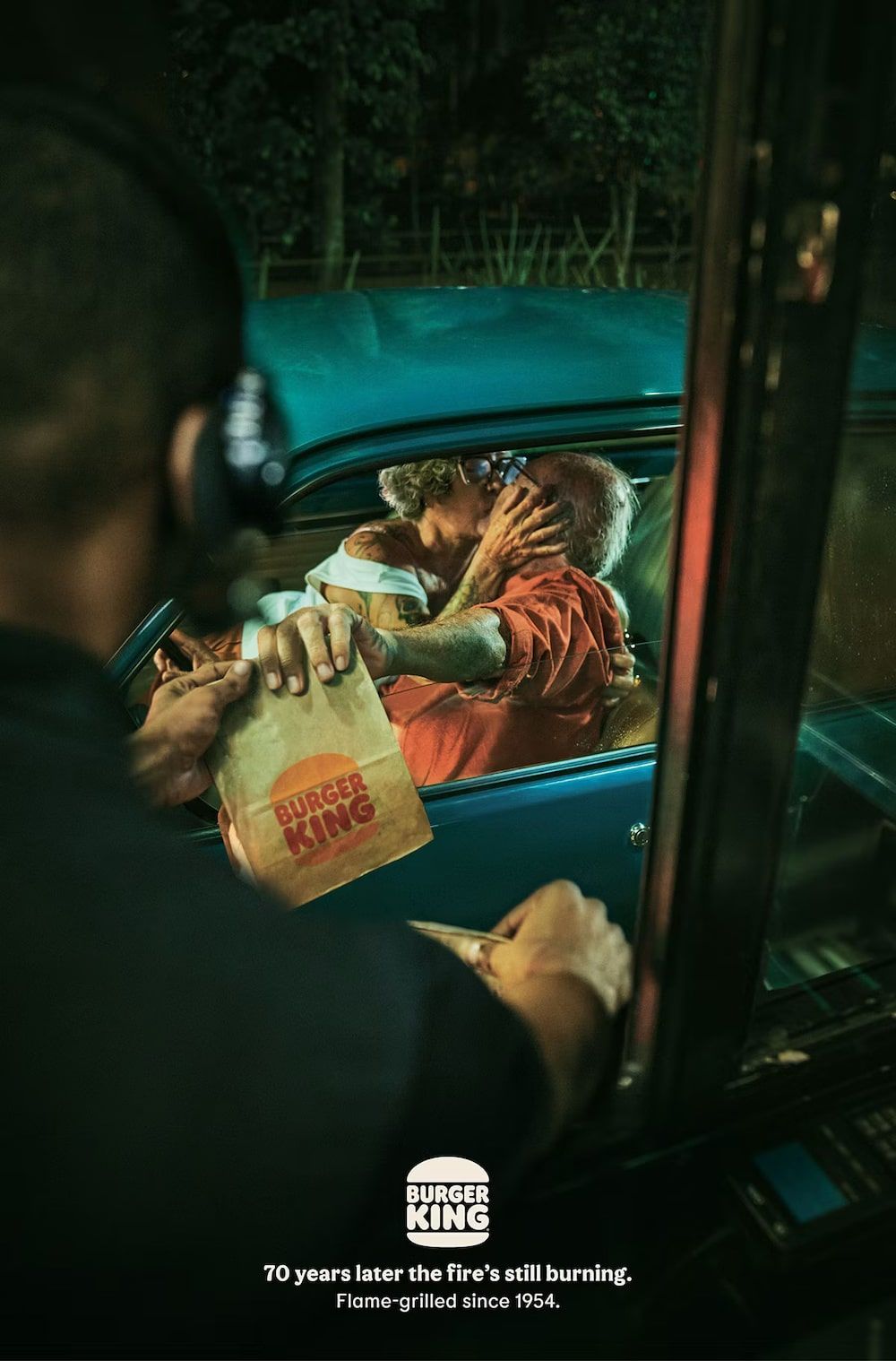 Valentine's Day Poster: Elderly couple kissing in a vintage car at a night drive-thru