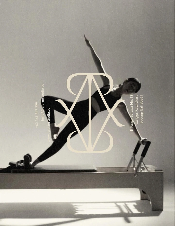 Gym & Fitness creative ad: Woman doing side plank on a Pilates reformer, black-and-white