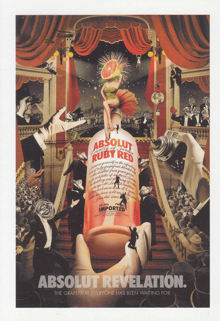 Creative ad: Grapefruit-headed showgirl atop a giant vodka bottle on a theatre stage