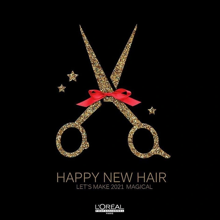 New Year creative ad: Gold glitter salon scissors tied with a red bow