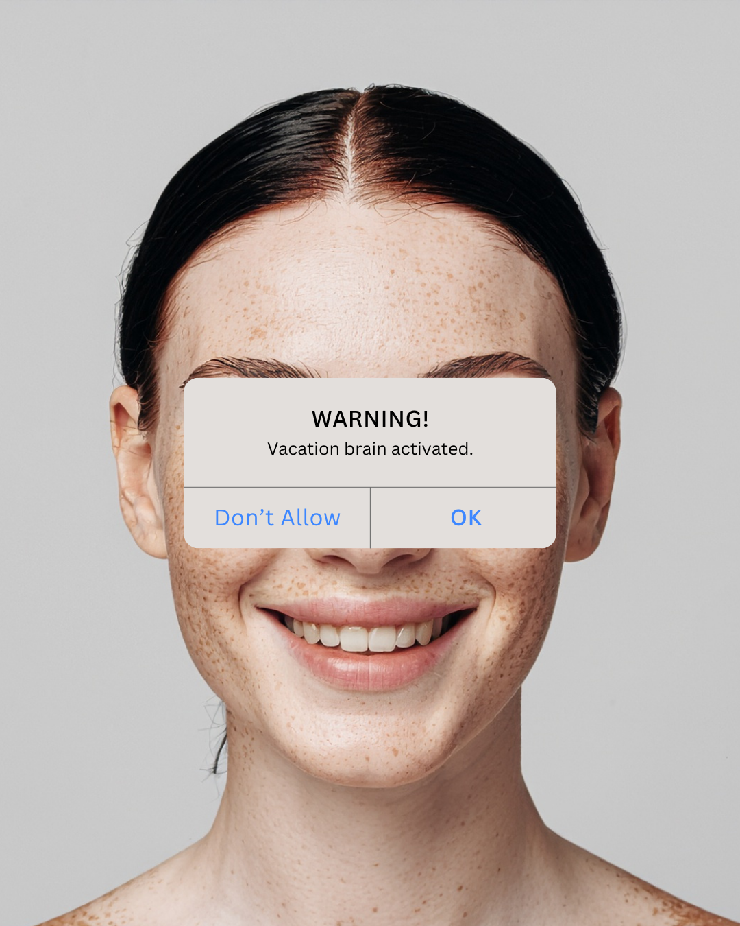 Instagram post: Phone warning dialog over freckled face