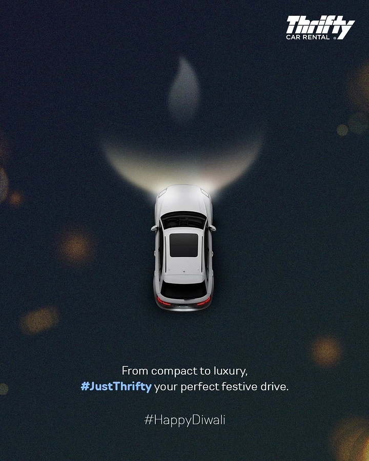 Diwali creative ad: Top-down white SUV whose headlight beam forms a diya