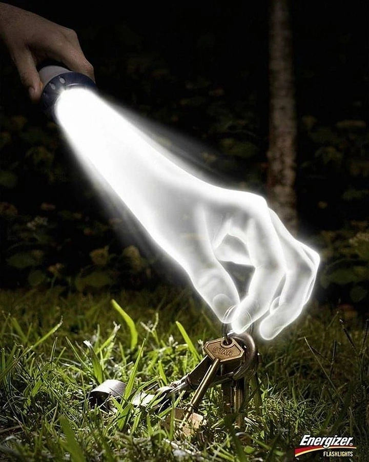 Batteries & Inverters creative ad: Flashlight beam shaped as a hand picking up lost keys