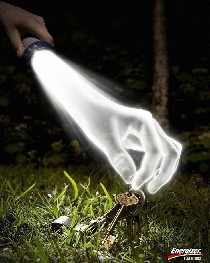 Instagram post: Flashlight beam shaped as a hand picking up lost keys