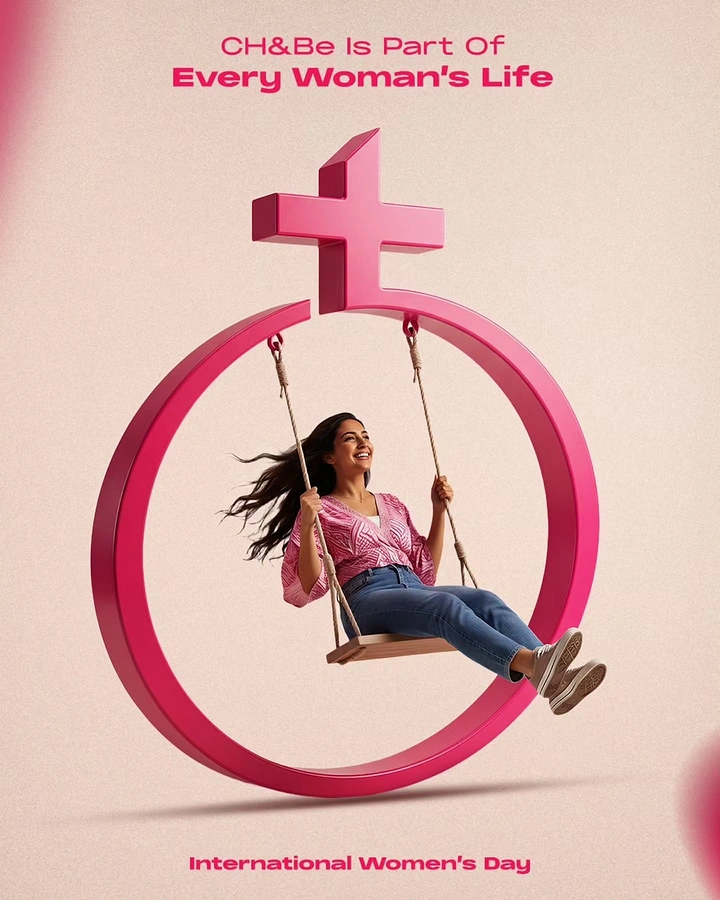 Women's Day creative ad: Smiling woman on a rope swing hanging inside a giant 3D female symbol