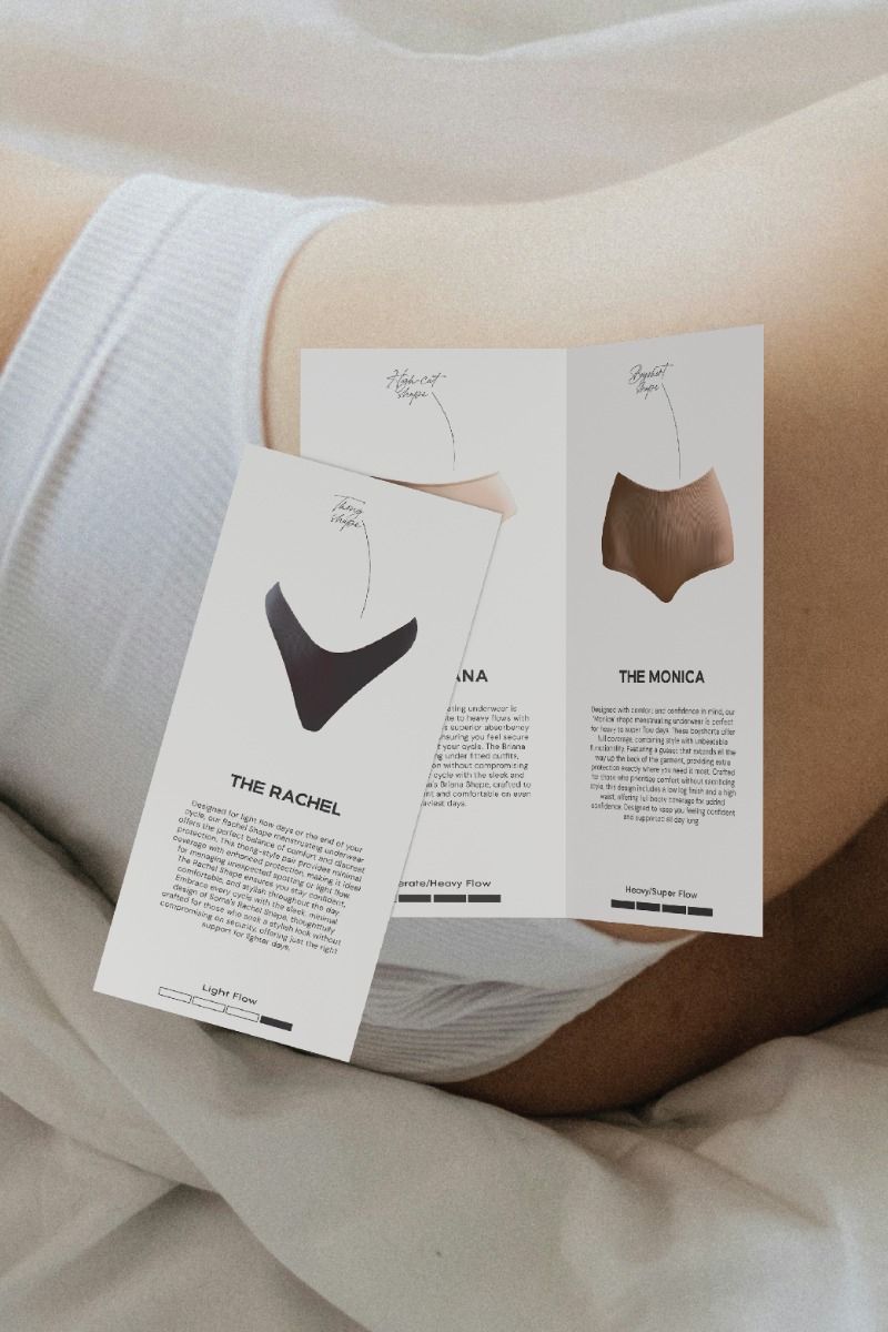 Instagram post: Printed period-underwear info cards laid over a woman lying in white linen