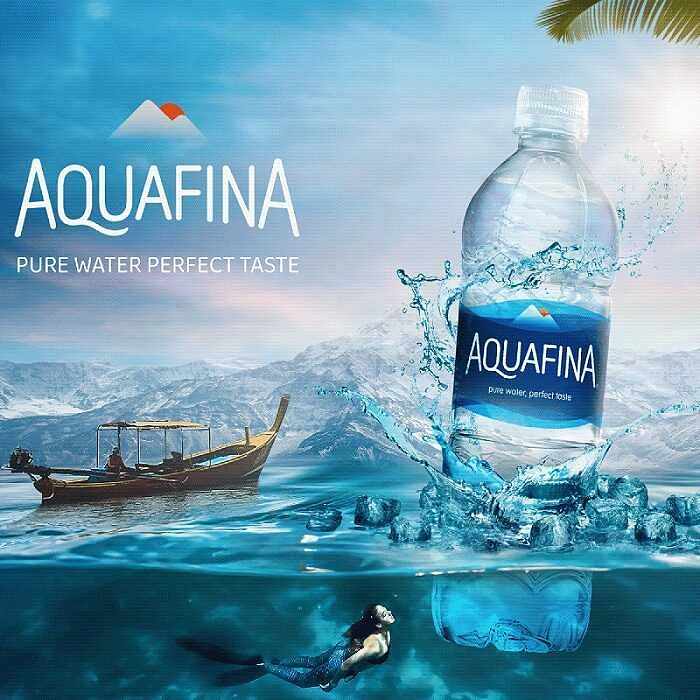 Packaged Drinking Water creative ad: Water bottle splashing into sea at split waterline