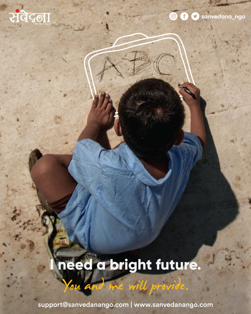 Overhead shot of a child writing ABC on the ground in chalk