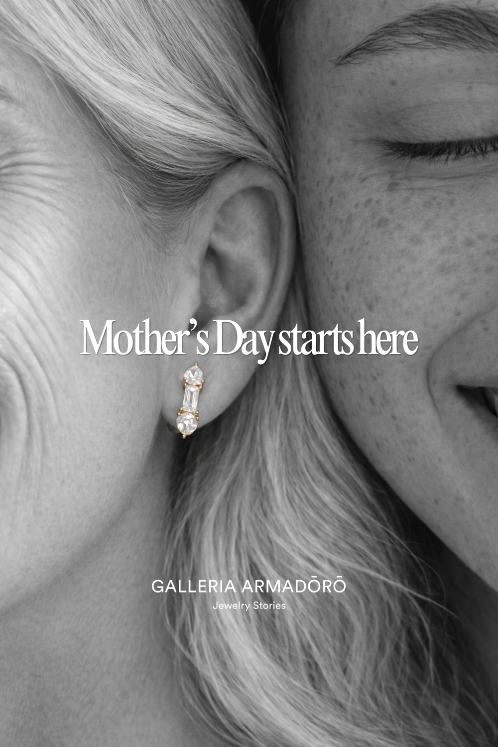 Mother and daughter cheek to cheek, with a gold baguette-diamond earring