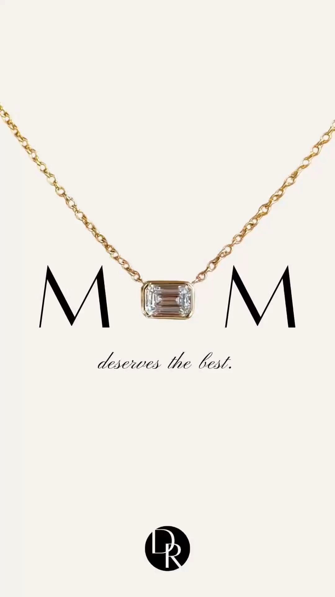Gold necklace with a diamond forming the word MOM