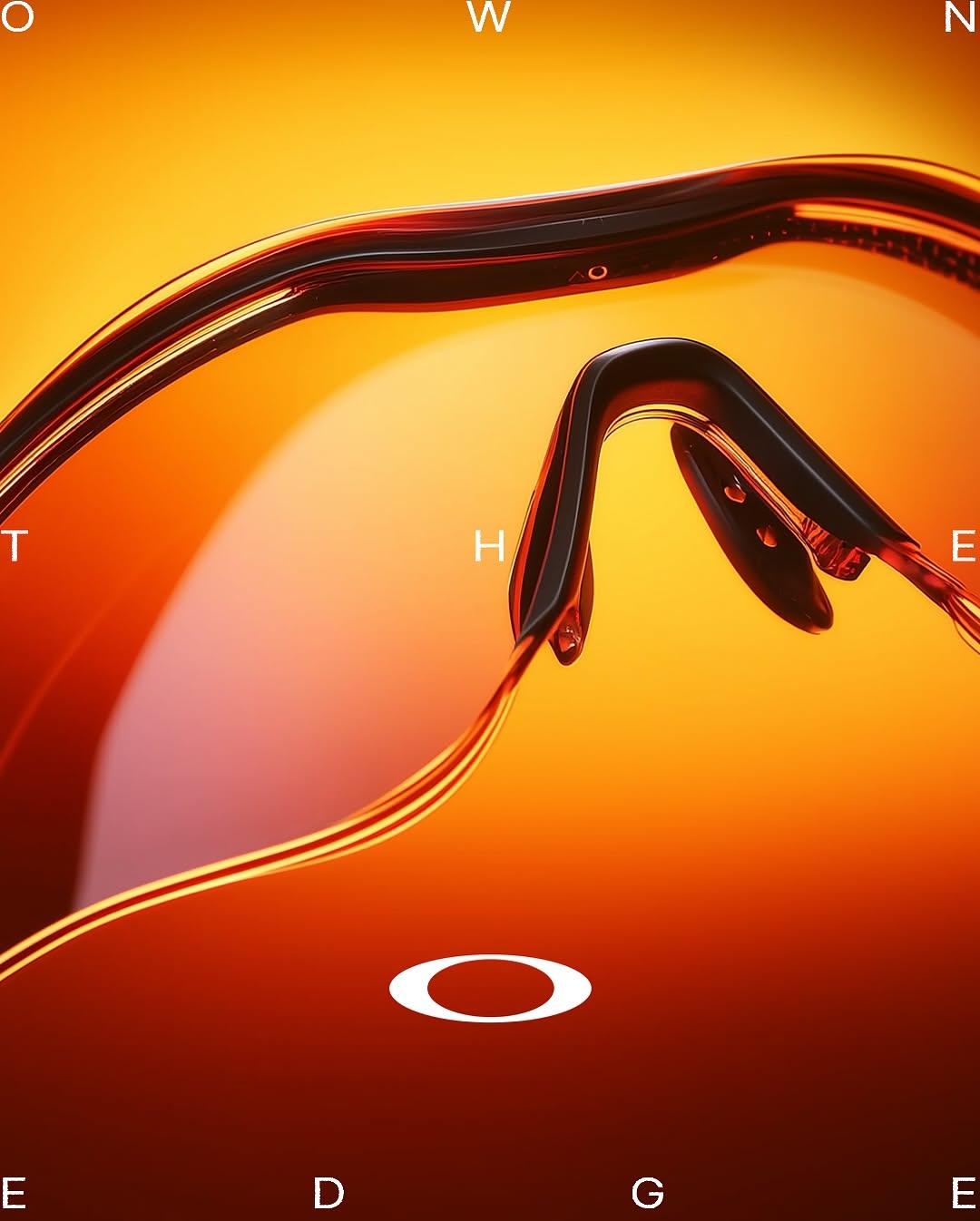 Carousel: Silhouetted figure in beanie and balaclava wearing mirrored orange wraparound shades, slide 2