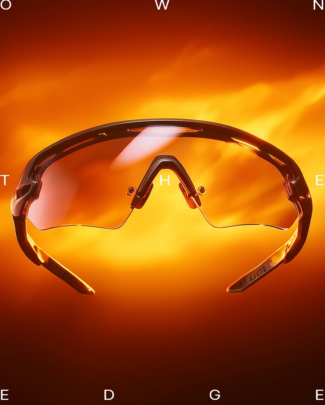 Carousel: Silhouetted figure in beanie and balaclava wearing mirrored orange wraparound shades, slide 4