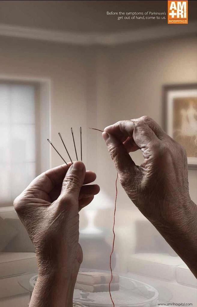 Healthcare creative ad: Elderly hands trying to thread one of several needles, suggesting tremor