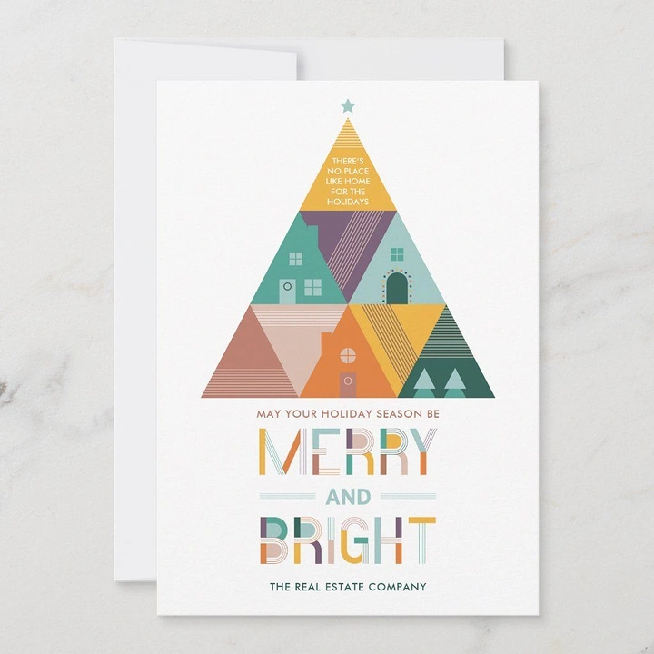 Christmas creative ad: Geometric Christmas tree built from triangular house tiles