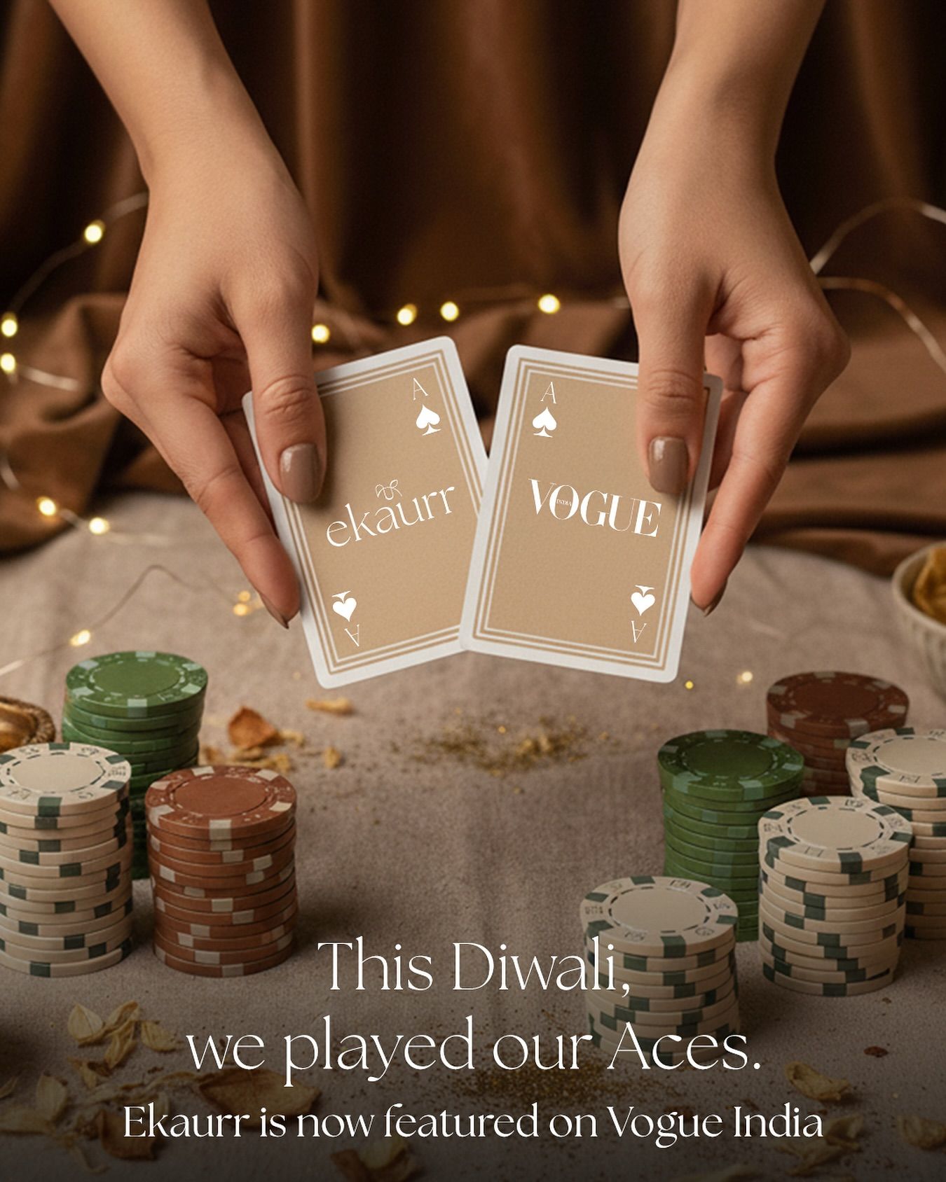 Hands holding two co-branded ace playing cards over poker chips