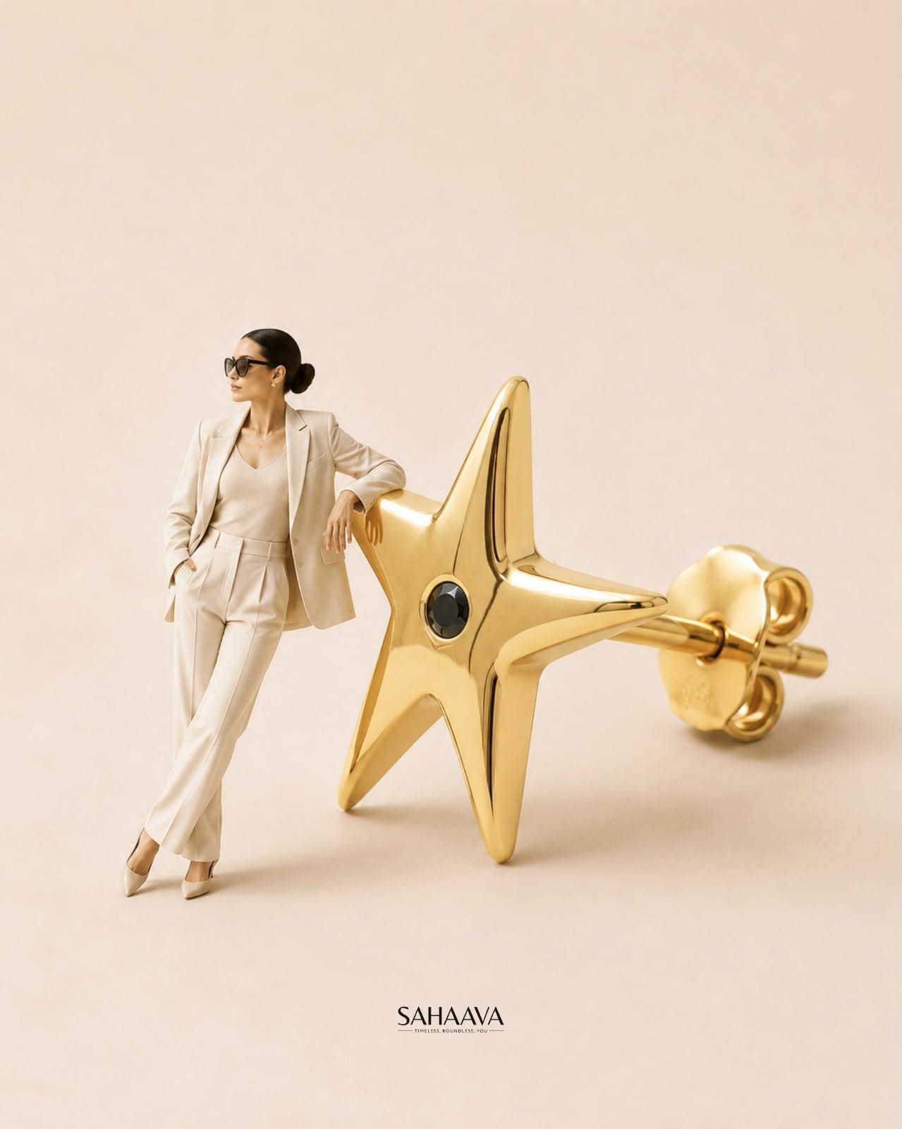 Woman in a cream suit sitting on a giant gold ring pendant