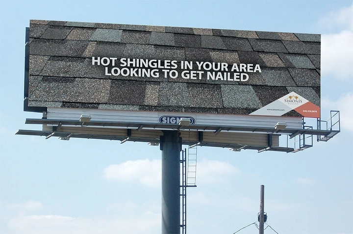 Roofing creative ad: Shingle billboard with 'get nailed' pun
