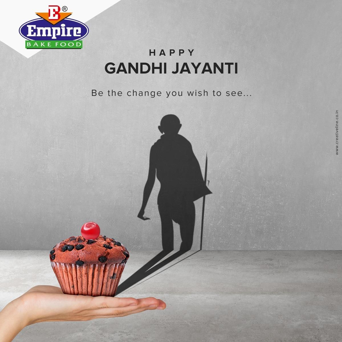 Cupcake on open palm casting a shadow of Gandhi walking