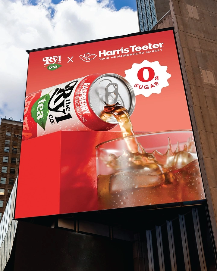Grocery Stores & Supermarkets creative ad: Tilted raspberry tea can pouring into iced glass on a building billboard