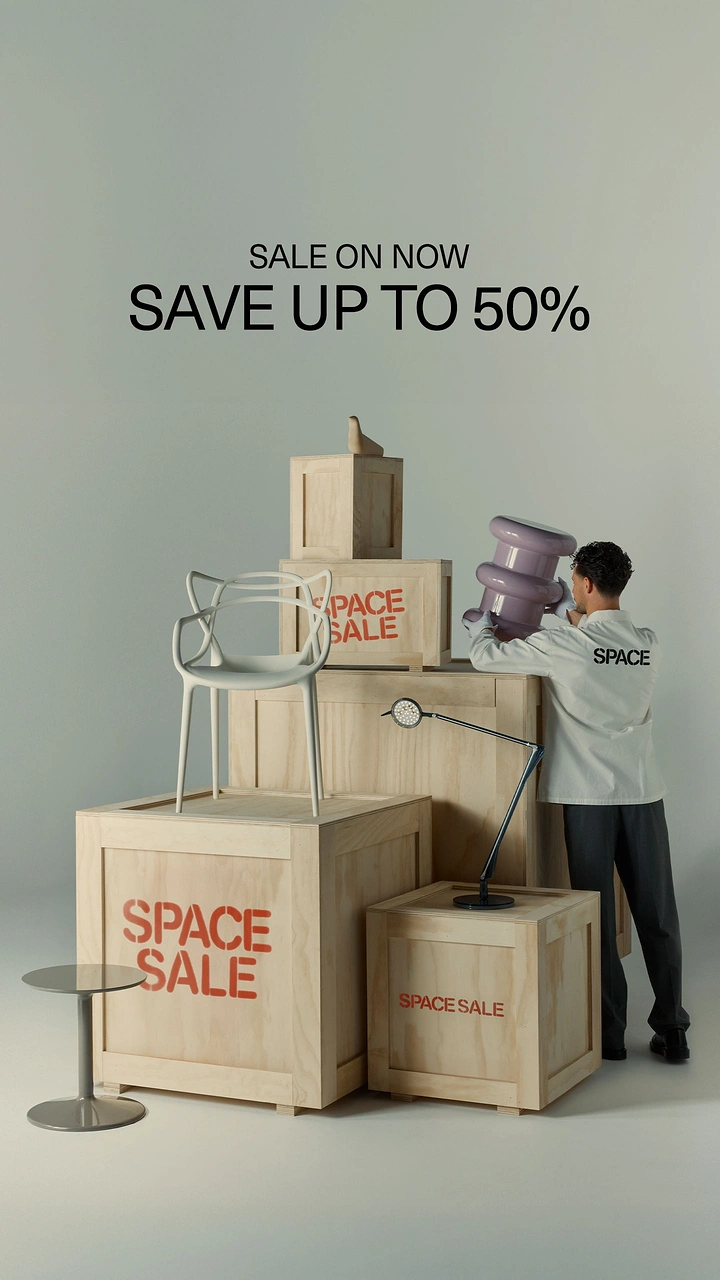 Creative ad: Man stacking designer furniture on plywood crates