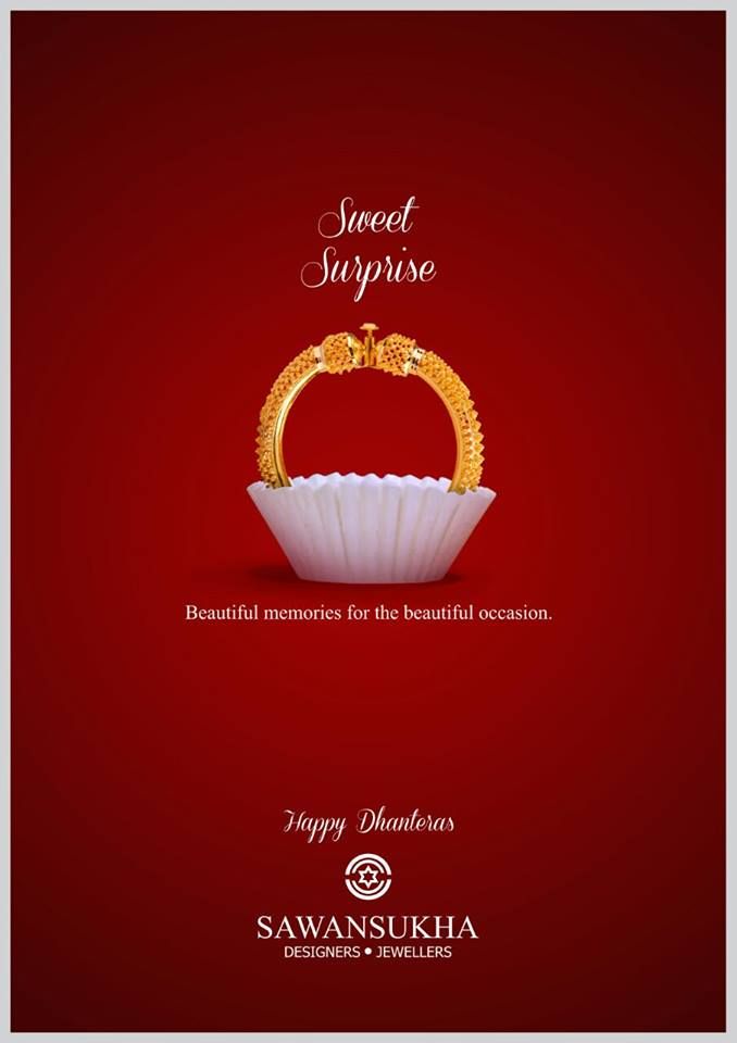 Gold bangle set in a white paper sweet cup