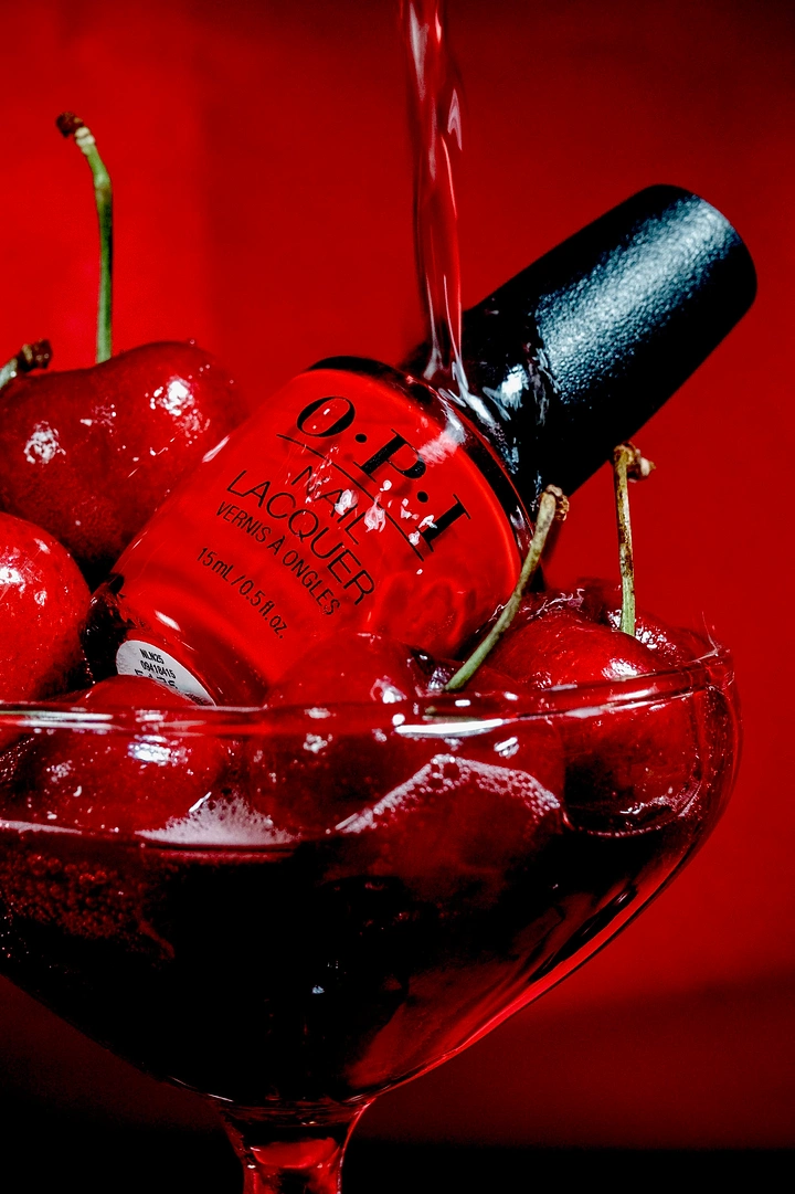 Nail Polish Brands creative ad: Cherry cocktail frames polish bottle