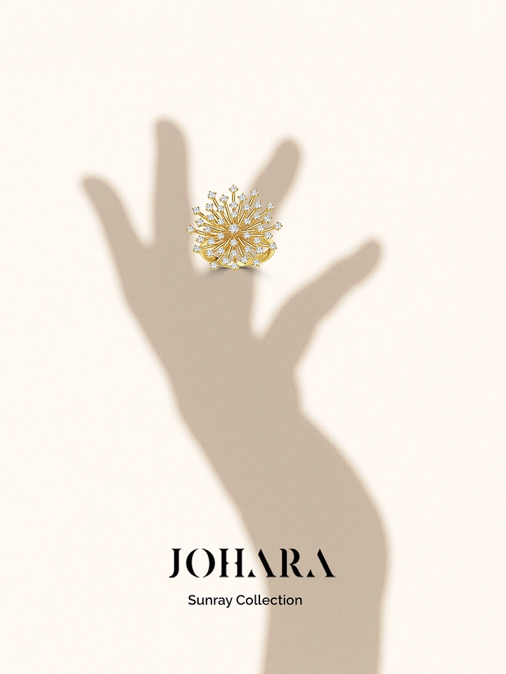 Jewellery creative ad: Gold diamond starburst ring floating on a soft hand shadow