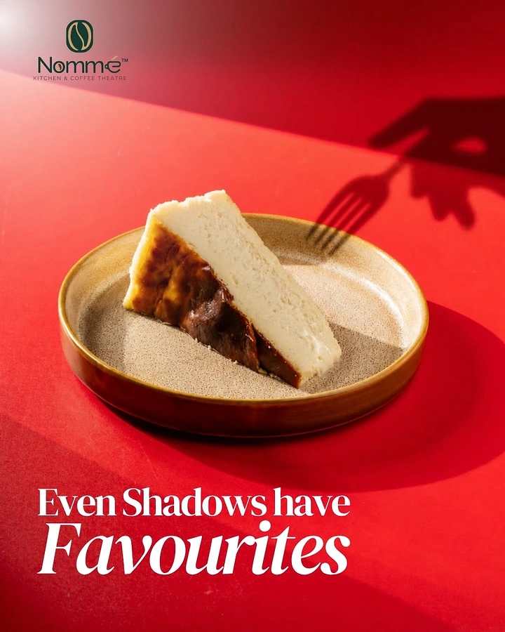 Coffee Shops creative ad: Basque burnt cheesecake slice with a fork-wielding shadow