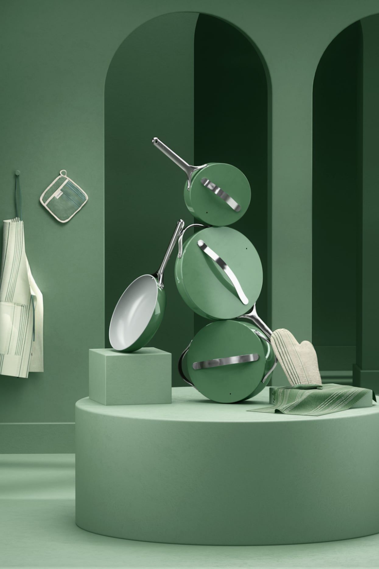 Instagram post: Sage-green cookware set balanced in a sculptural stack on a plinth