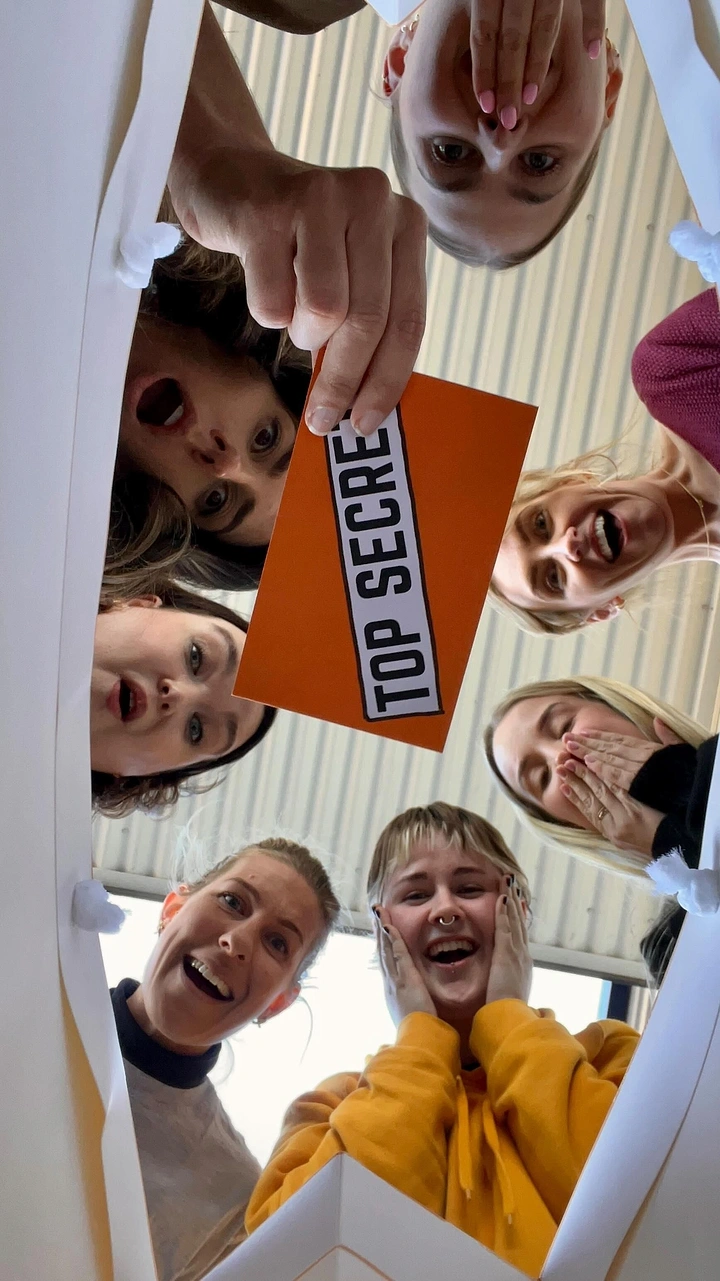 Escape Rooms creative ad: Team staged inside top-secret box